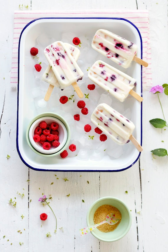 Homemade yogurt ice cream pops with raspberries