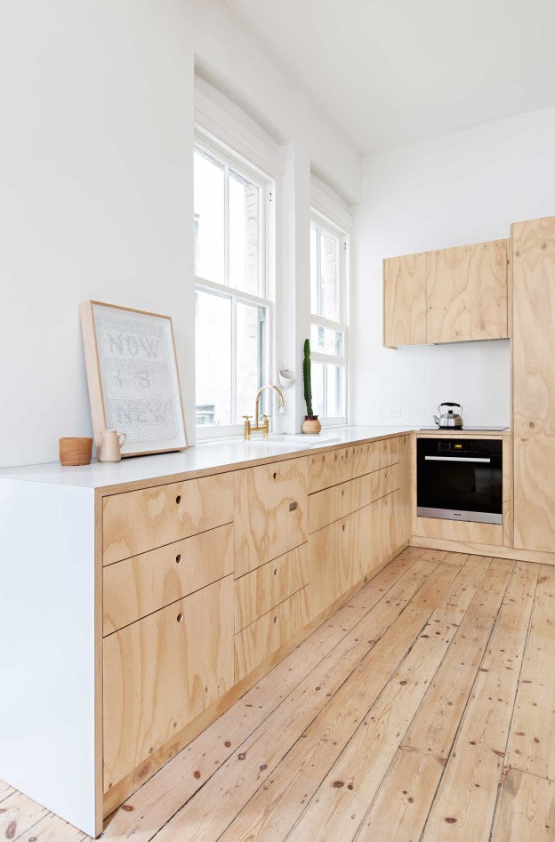 Plywood home with a touch of salmon